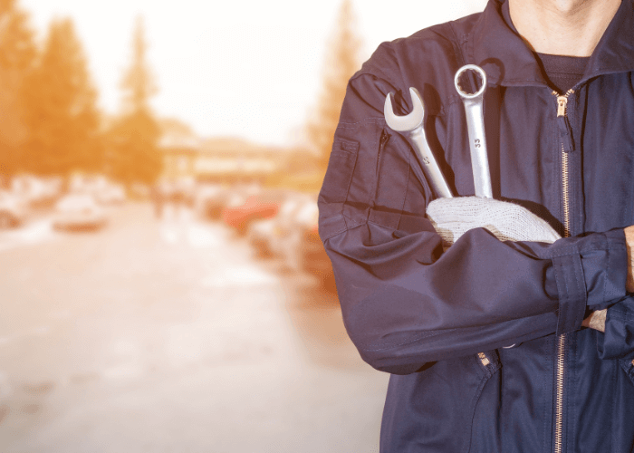 mechanic holding tools